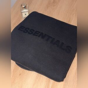 fear of god essentials black zip up